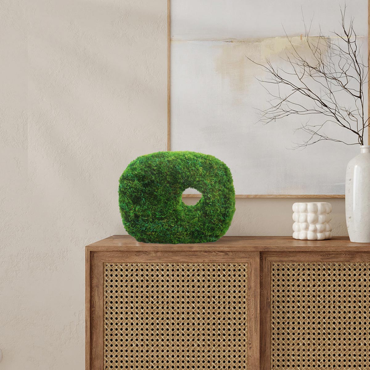 Totem-inspired moss sculpture enhancing biophilic design in living space